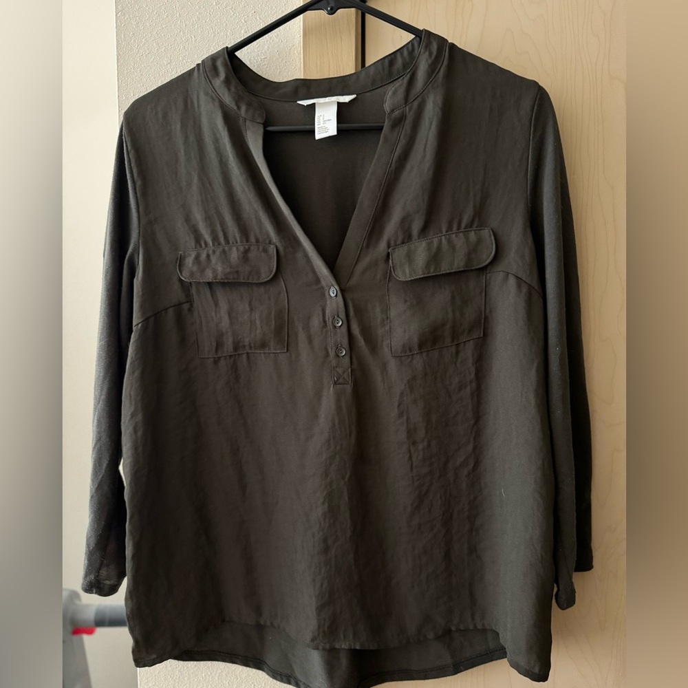Long sleeved blouse. Dark green colored.
